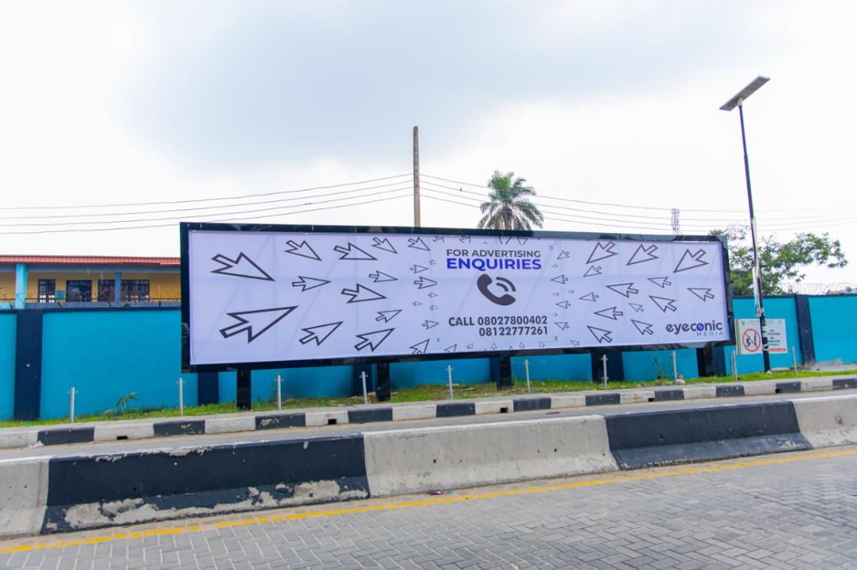 A well-located wall panel along St. Finbarrs Road, Akoka UNILAG area, near Bariga Market, offering strong visibility to motorists and pedestrians.