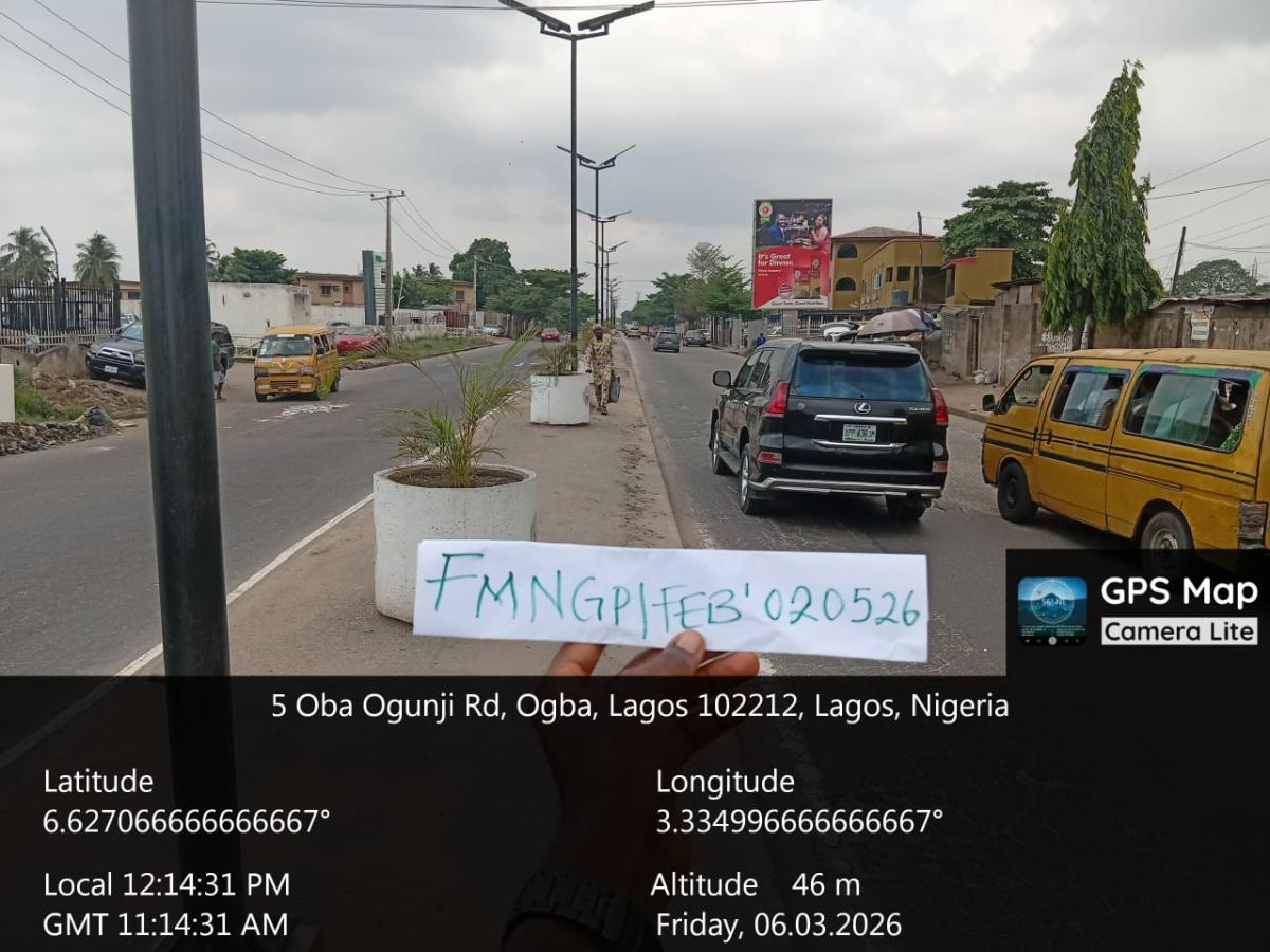 OBA OGUNJI FACING TRAFFIC TO PEN CINEMA