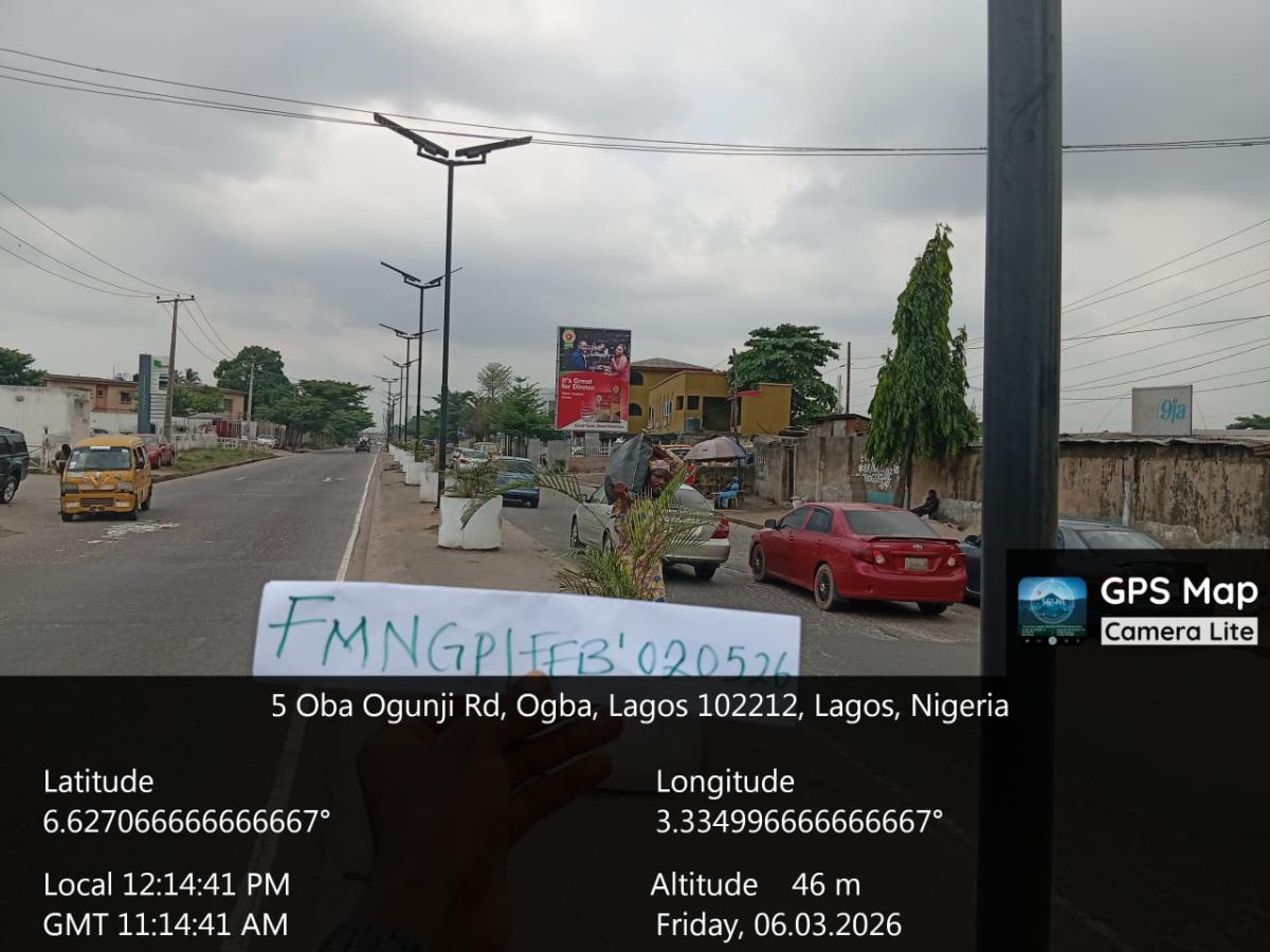 OBA OGUNJI FACING TRAFFIC TO PEN CINEMA