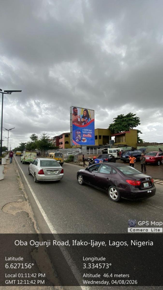 OBA OGUNJI FACING TRAFFIC TO PEN CINEMA