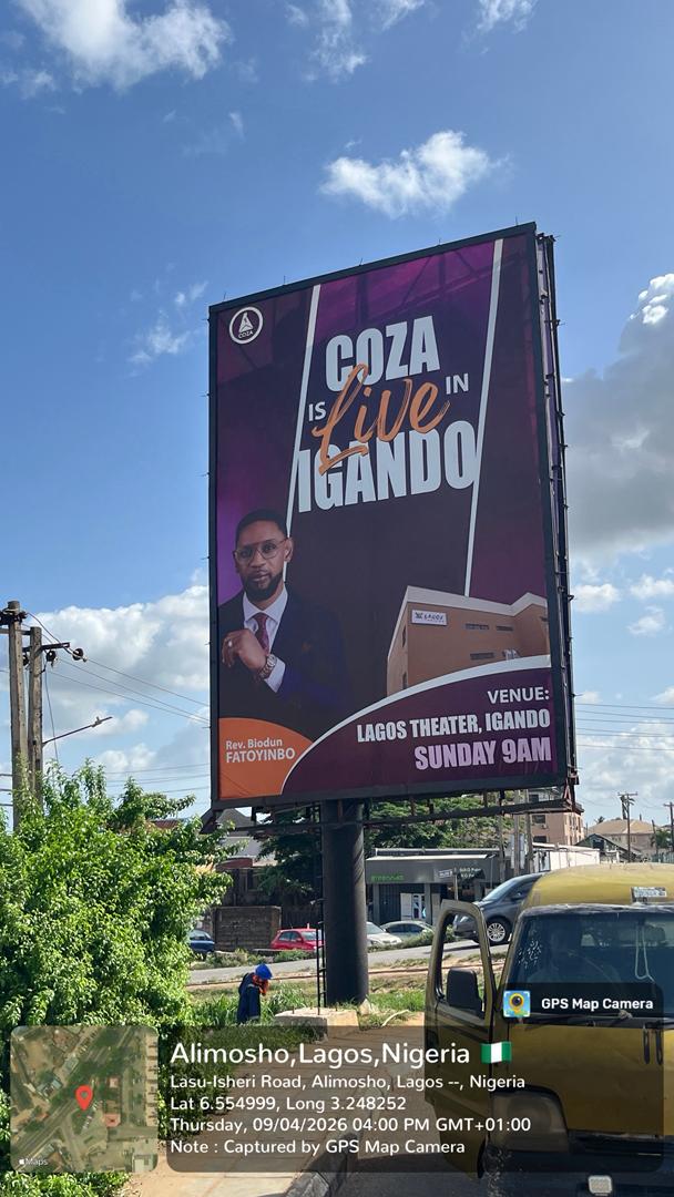 A tall double-sided portrait billboard mounted on a monopole structure, located at lasu-igando expressway, opposite federal housing estate, positioned along a busy urban road with high vehicular visibility suitable for outdoor campaign