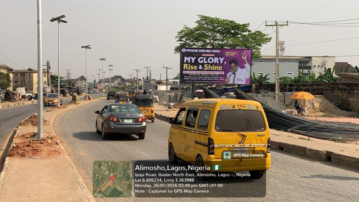 A bold and highly visible super 48 sheet billboard strategically positioned along a busy roadside in ipaja, alimosho, lagos. double-faced billboard delivereing maximum brand exposure to motorists, commuters, and pedestrians.