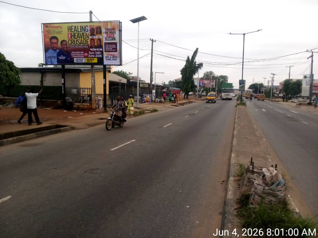 unipole billboard on Idimu Road, Egbeda-Idimu. Located before Car Wash Bus Stop, facing Egbeda-Ikotun traffic. High visibility, busy commercial route.