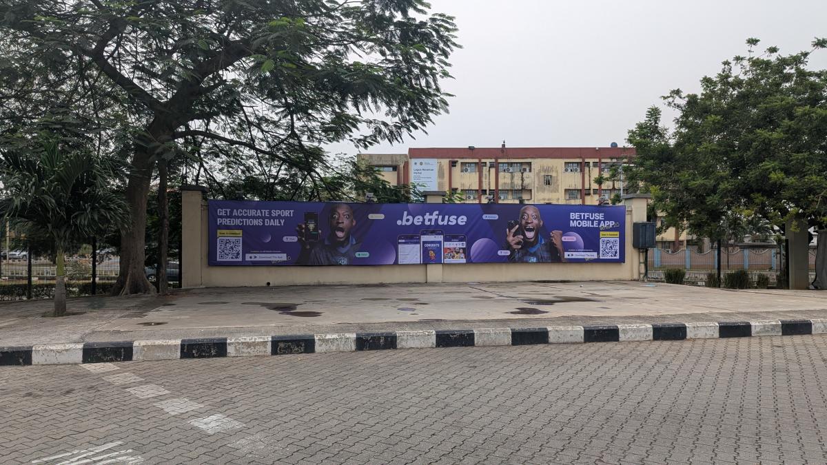 Positioned at eye-level alongside the entry lane, the board capitalizes on slow-moving vehicular traffic and pedestrian influx, ensuring extended exposure and maximum brand recall.